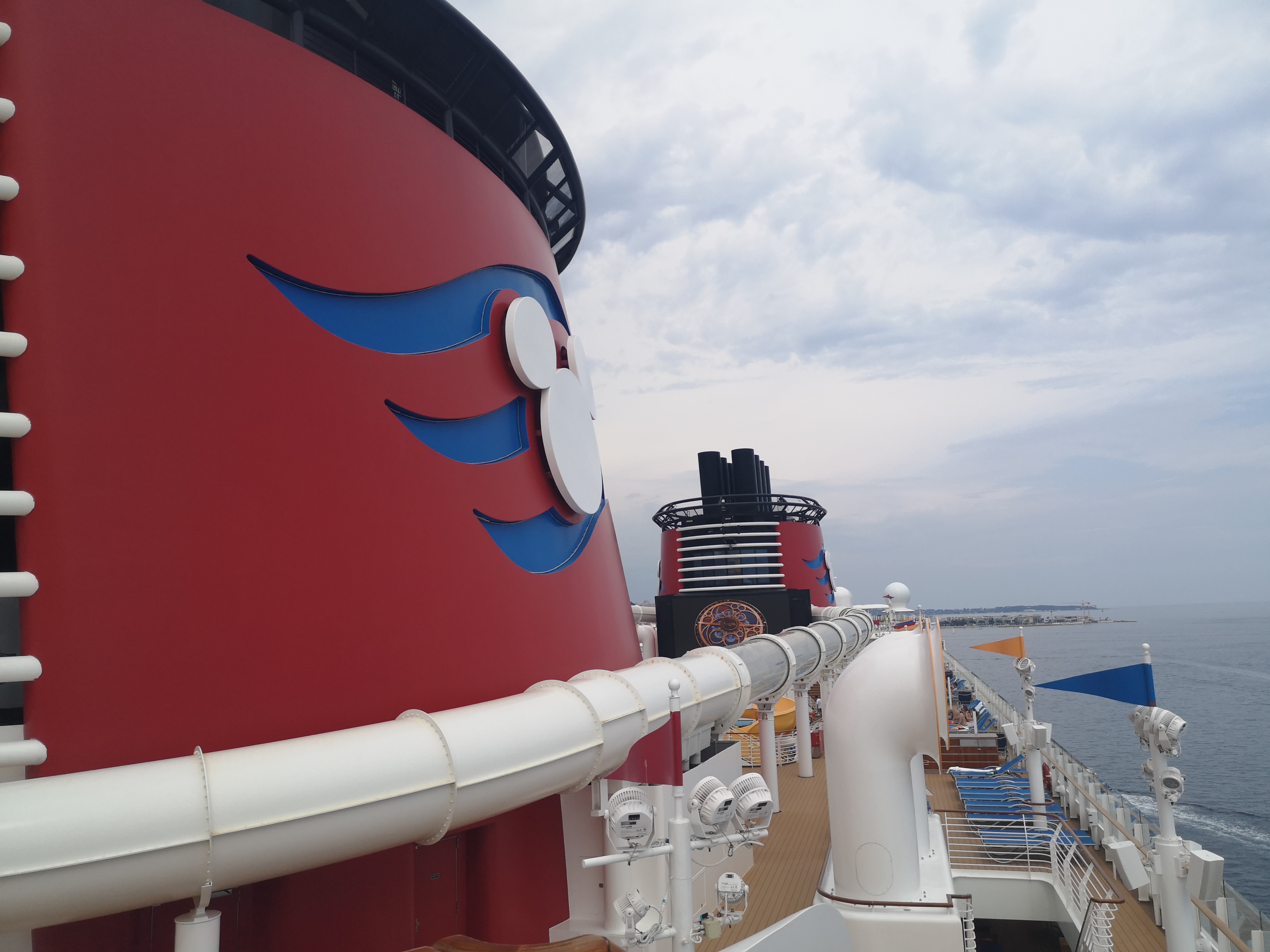 A Mickey Magic consultant on the deck of a Disney ship